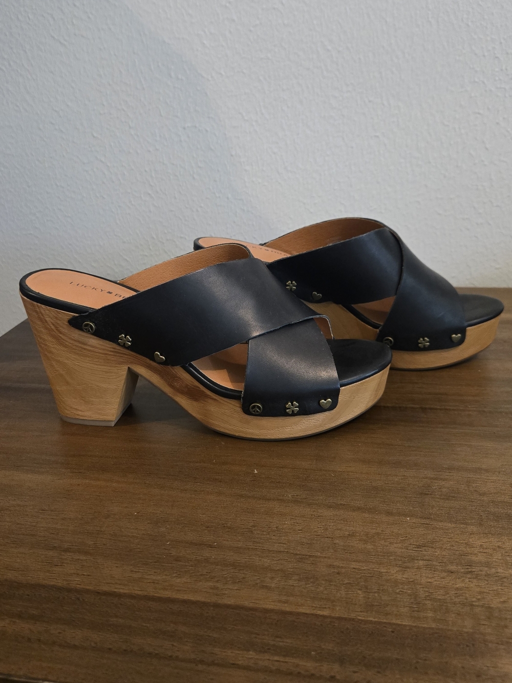 Lucky Brand black leather clogs with wooden heel and metal charms